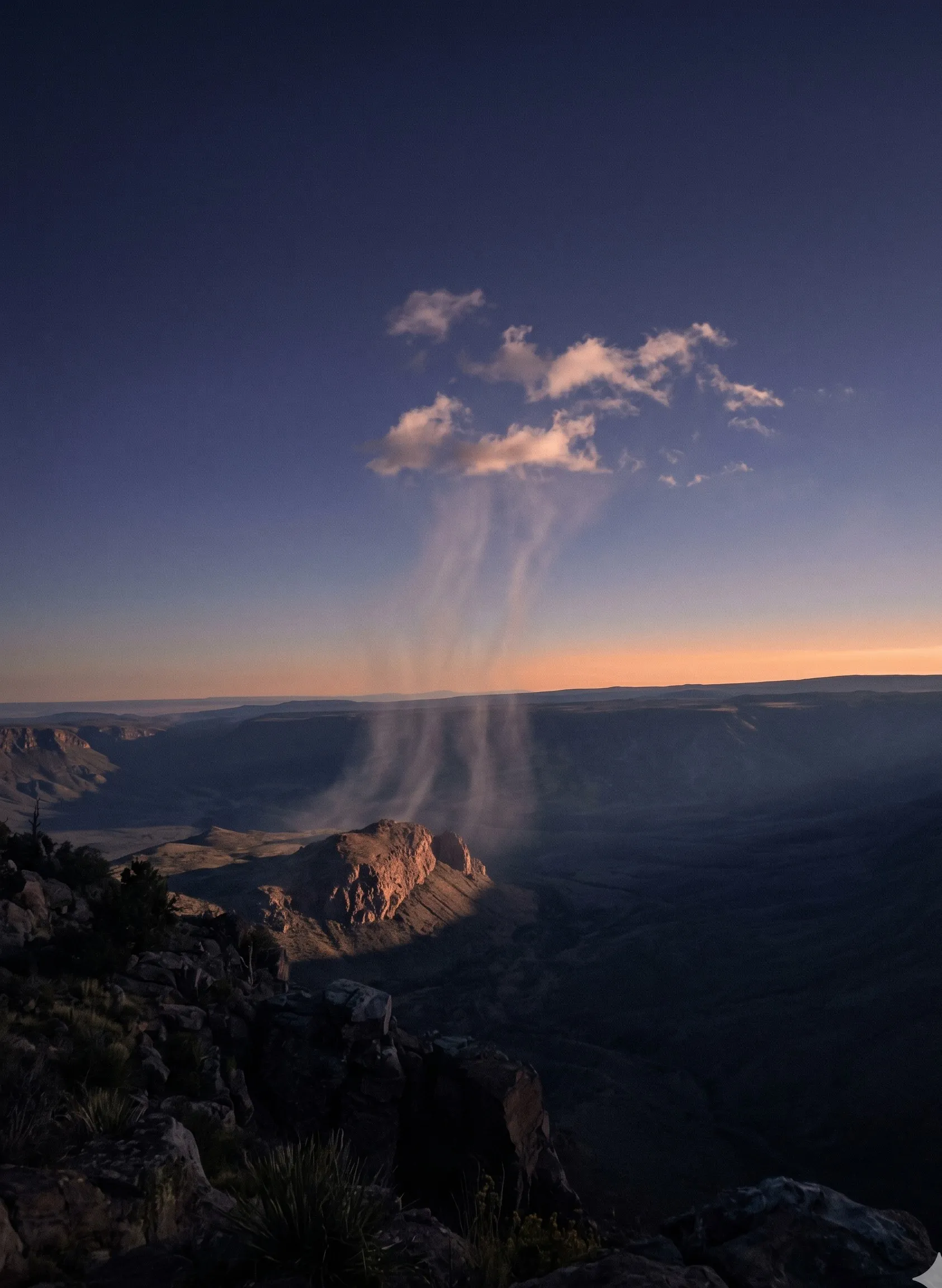A column of warm air rising from a sun-warmed canyon at dawn, single cloud forming at the top, papaya horizon band visible across the valley